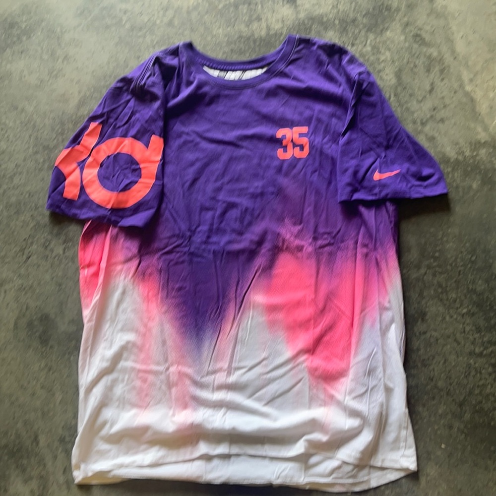 Nike T-shirt. Like new. More peachy color than pink. Purple.